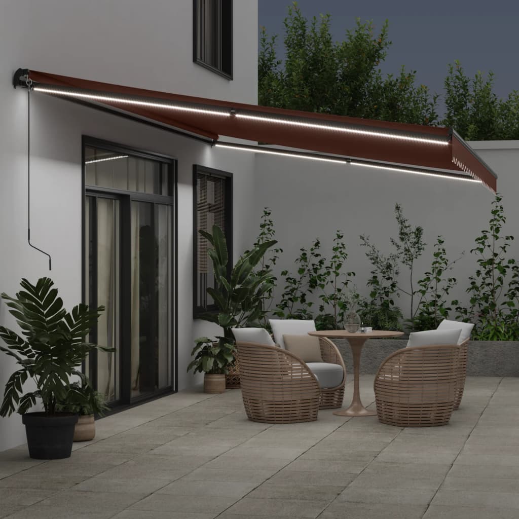 Manuell uttrekkbar markise med LED brun 600x350 cm
